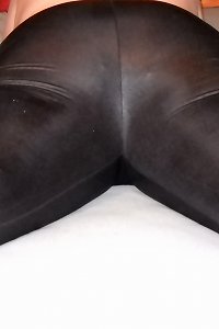 an aged chick with wooly body is sitting down on a couch